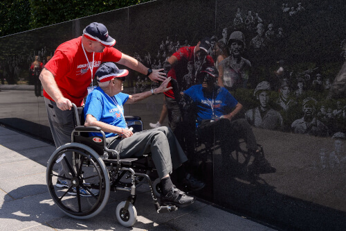 Honor Flight group photo at memorial